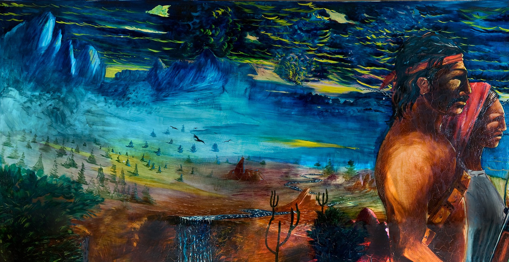 Section of "Chicano History" mural painting showing blue mountains and water, desert plants, birds, and a large figure with dark hair on the right.