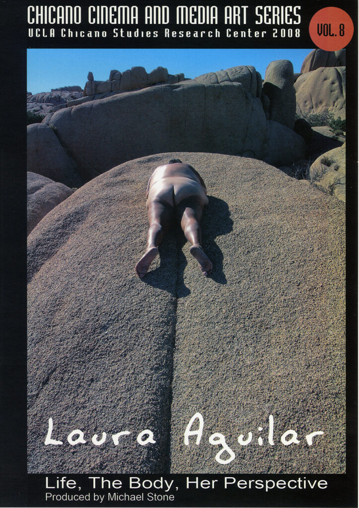 DVD cover with color photo of the artist lying naked and facedown on a large rock formation, with large rounded rock formations in the background.