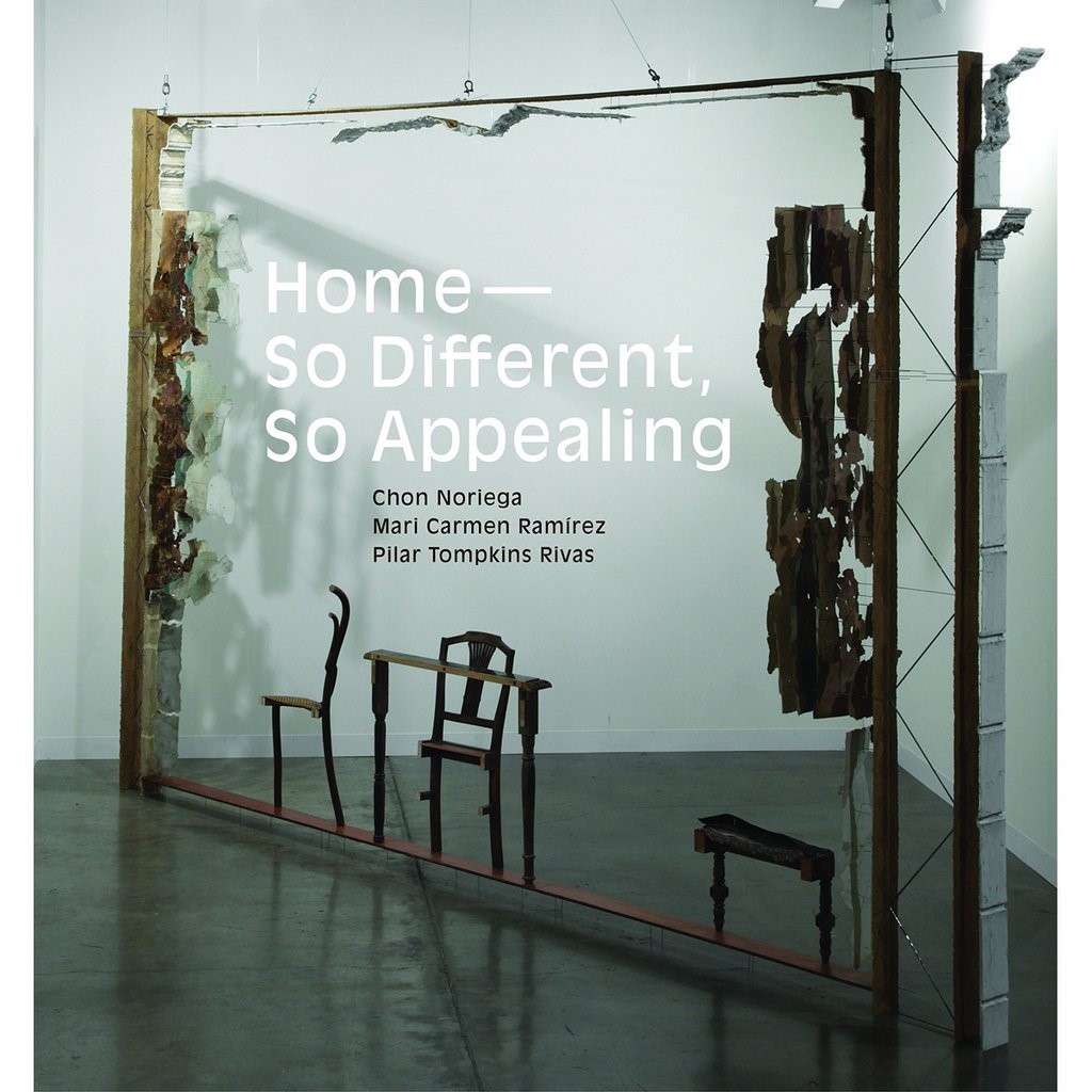 Book cover showing an art installation with a large wood frame, two chairs and a table, and title in white text.