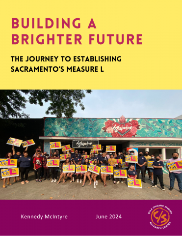 Research report cover showing photo of a large group of youth gathered outdoors holding colorful Measure L signs in front of a building.
