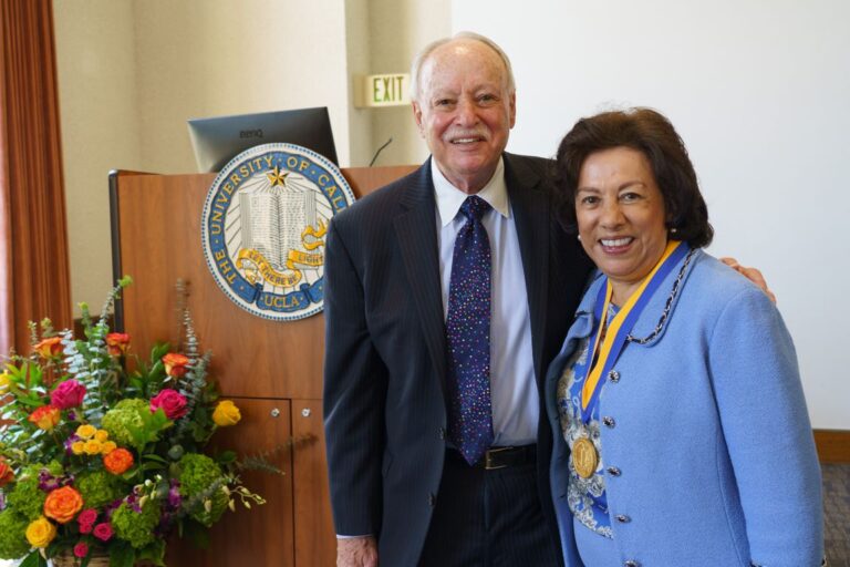Antonia Hernández, right, with her husband, Michael Stern, at the medal ceremony in Royce Hall.