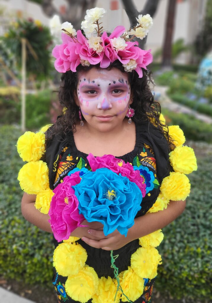 Young girl in Day of the Dead celebration face print