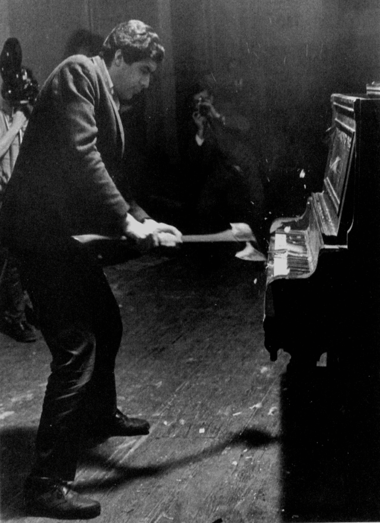 Raphael Montañez Ortiz destroying a piano with an axe at a concert in New York 1967.