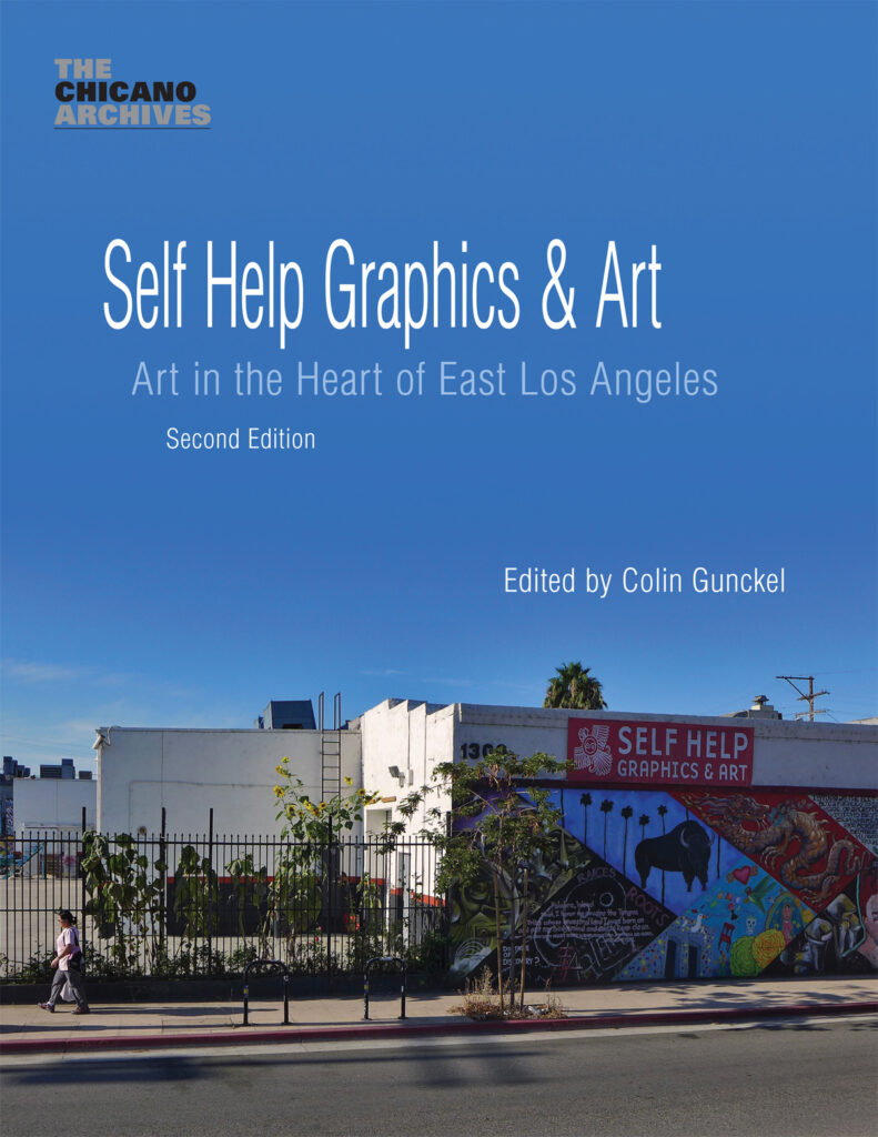 Blue book cover with a photo of the Self Help Graphics & Art building and colorful mural under a blue sky.