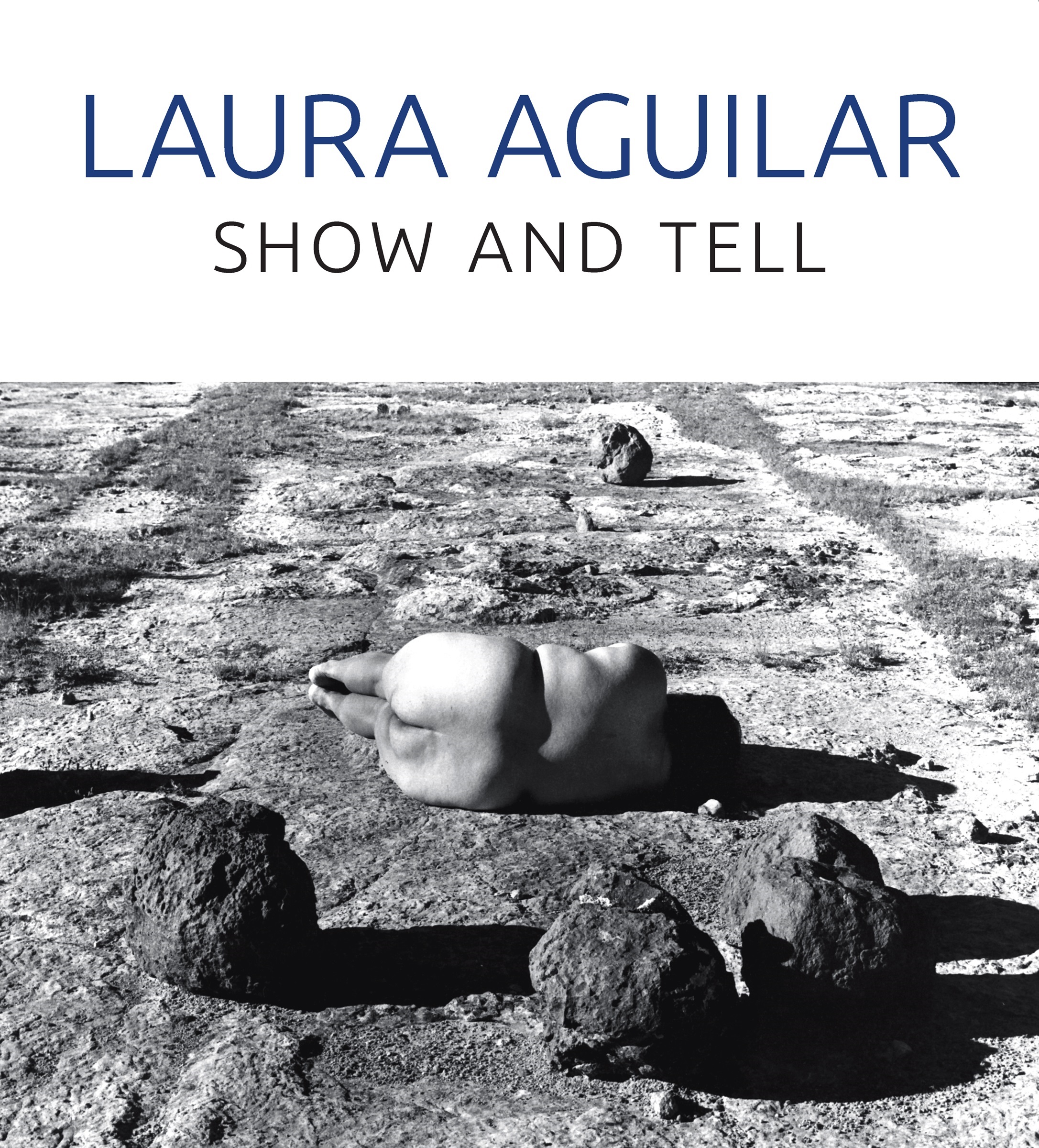 White book cover with a black and white photograph of the artist lying nude on a rocky landscape, and title in dark blue text.