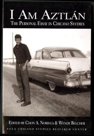 I Am Aztlán book cover showing a black and white photograph of a man standing beside a vintage car on a road.