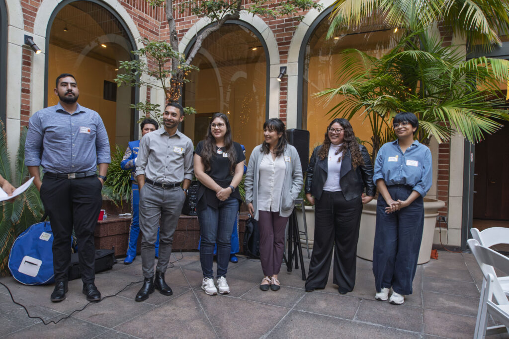 Six CSRC HSI Faculty Affiliates standing together in an outdoor courtyard, smiling and posing for a group photo.