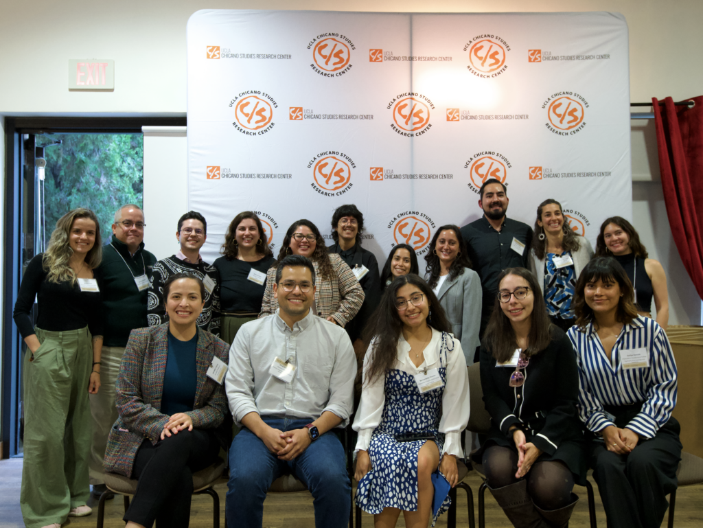 Sixteen UCLA Chancellor's Postdoctoral Fellows and new faculty posing together at a CSRC event in fall 2024, with a CSRC backdrop behind them.