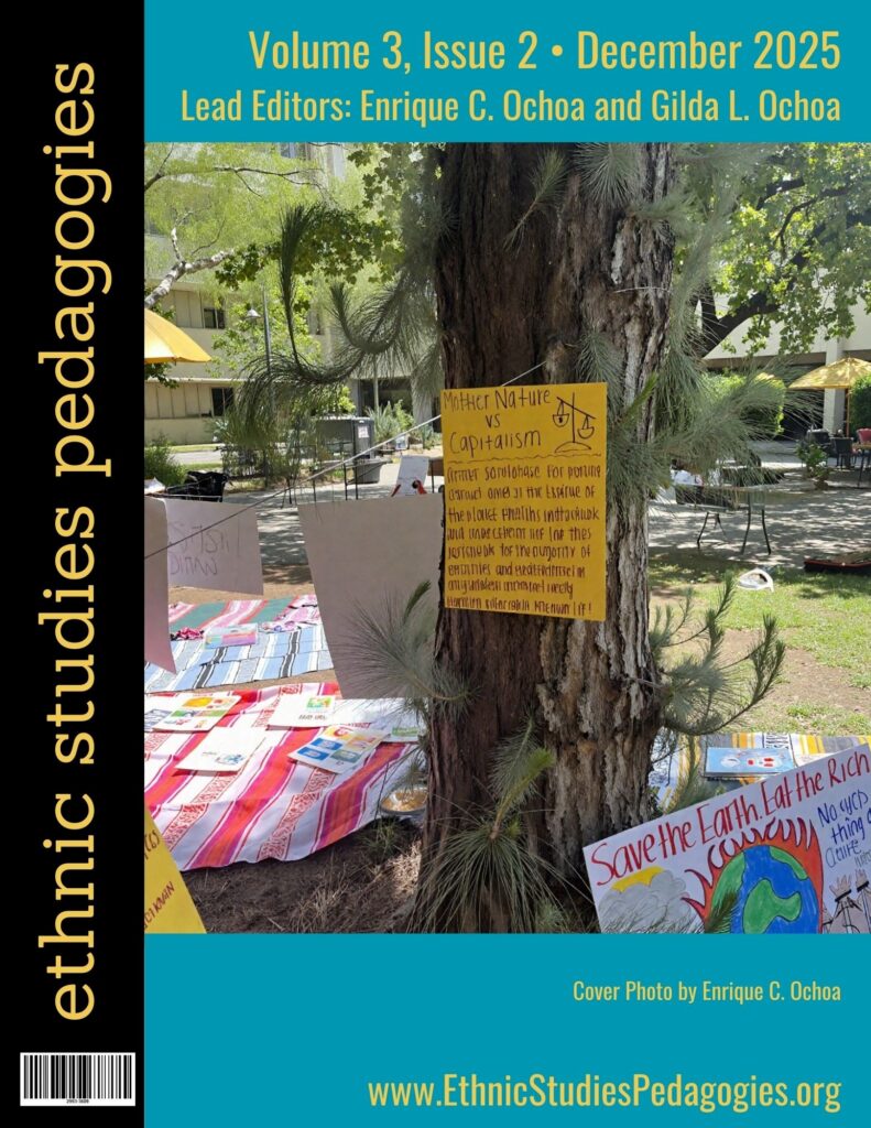 Ethnic Studies Pedagogies journal cover showing a photograph of a tree surrounded by colorful hand-drawn signs.